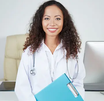 smiling-female-physician-with-clipboard-office